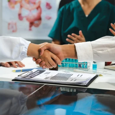 Applause, success with doctors in meeting for presentation, medical and research. Training, healthcare with group of people workshop event for medicine, target or teamwork.