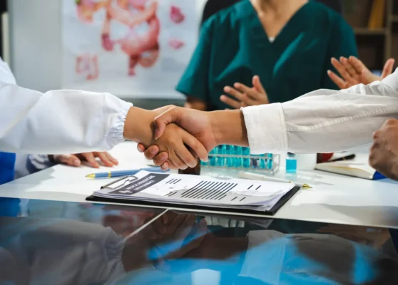 Applause, success with doctors in meeting for presentation, medical and research. Training, healthcare with group of people workshop event for medicine, target or teamwork.